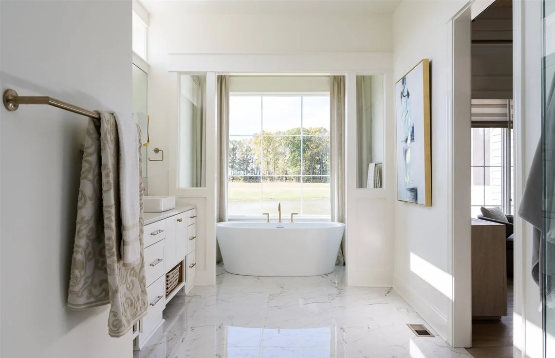 Newly remodelled bathroom with a freestanding tub and tiled surround