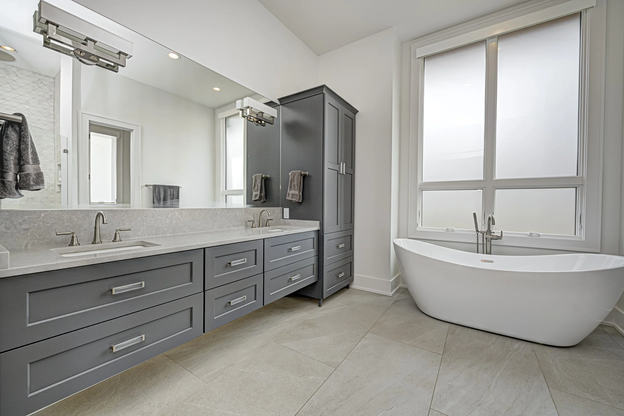 Interior with custom built-in shelving and concealed storage millwork
