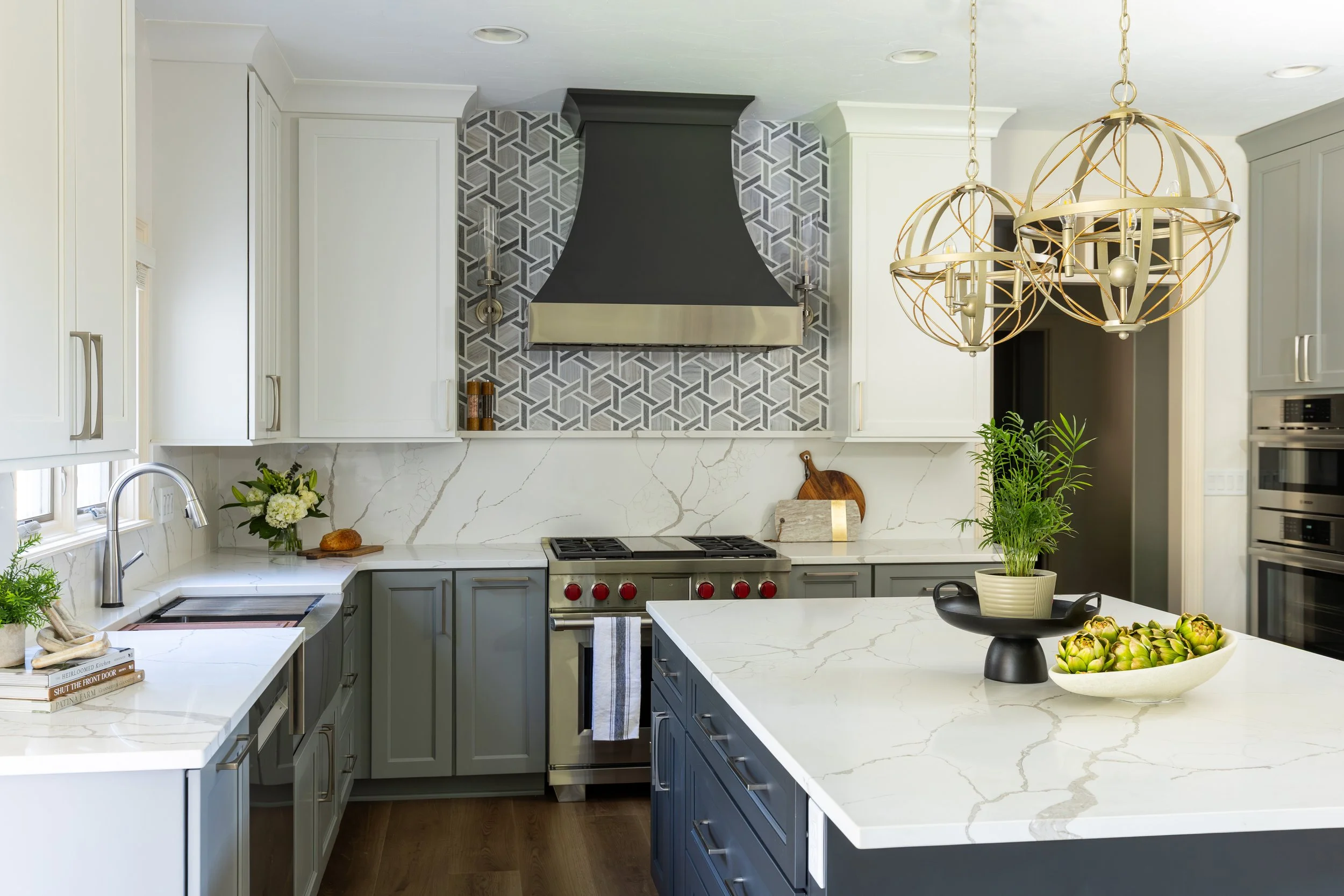 Custom kitchen remodel in Carmel, Indiana with natural wood cabinetry and a marble island