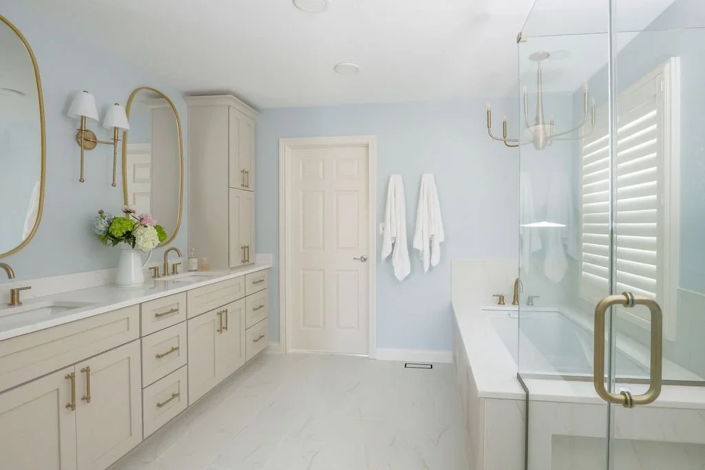 Carmel luxury bathroom remodel with soft pastel cabinetry and marble tile