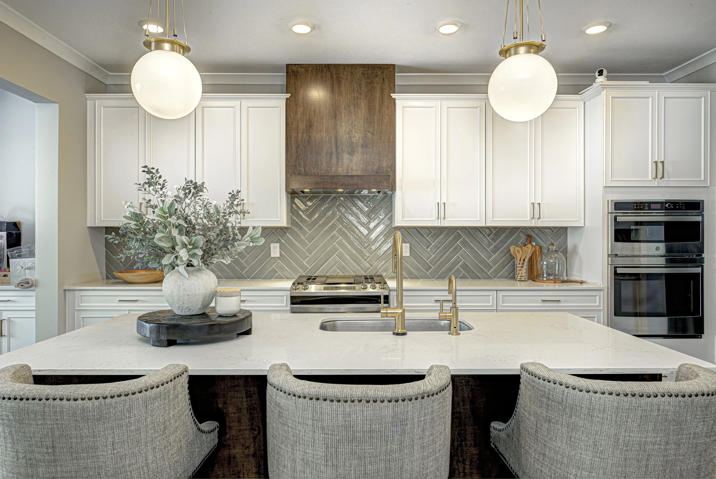 Westfield kitchen remodel with sage green cabinetry and pale stone countertops